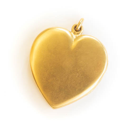 A large antique gold heart locket