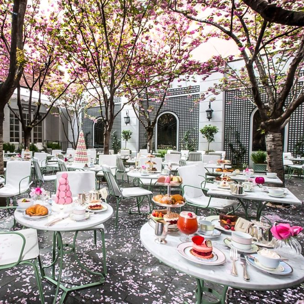 Tables set with afteroon tea ouside at Laduree Soho