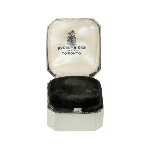 A vintage cushion shaped vintage sterling silver ring box with a silk lining with Ryrie Birks imprinted on it